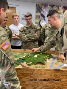 Image from 2022 of cadets doing sandtable work. 