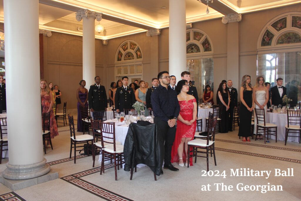 The 2024 Military Ball at The Georgian with cadets and their dates standing around circular tables. 