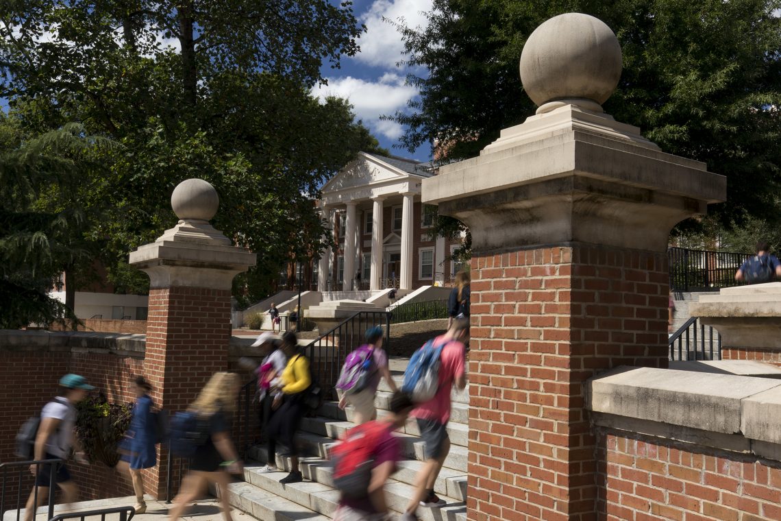Students walk up the steps by Park Hall.