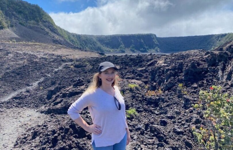 Emily Baldwin posing for a photo while hiking in Hawaii.