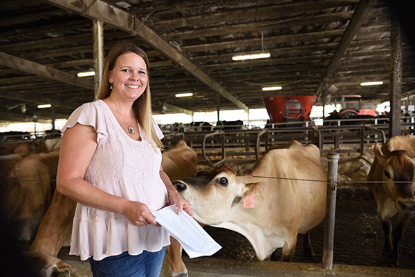 Jillian Bohlen portrait in front of a cow